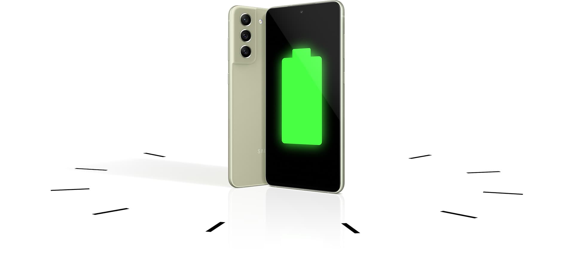 Two Galaxy S21 FE 5G phones seen standing upright, one seen from the rear and one seen from the front with a full battery icon onscreen. The
                phones stand within a clock to demonstrate the long-lasting battery. 